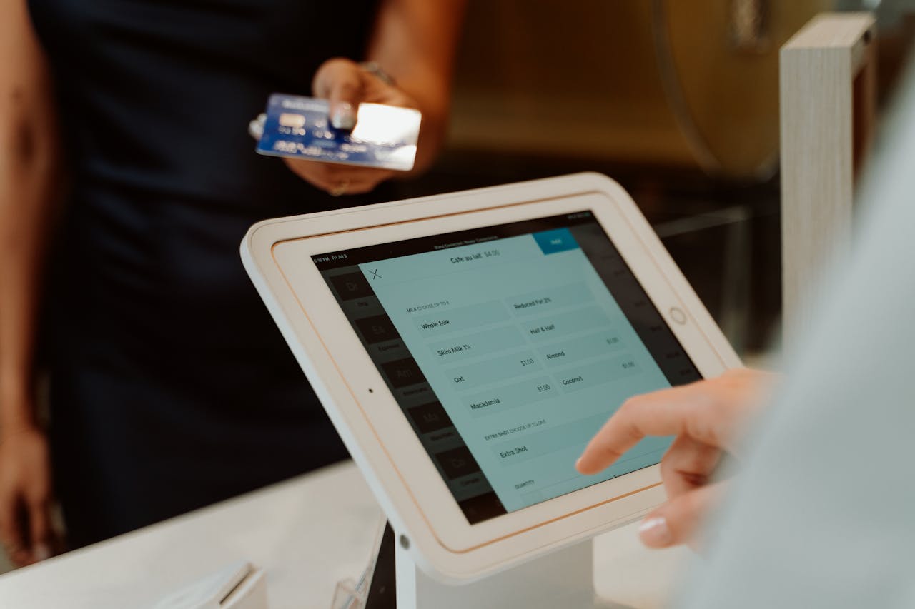 A modern cashless payment system using a tablet and card for seamless transactions.
